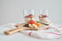 Delicious breakfast with fruits and berries served on table