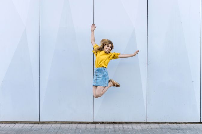 Young cheerful woman jumping