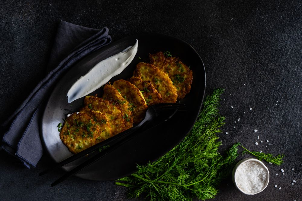 Top view of traditional Ukrainian dish deruny served with sour cream