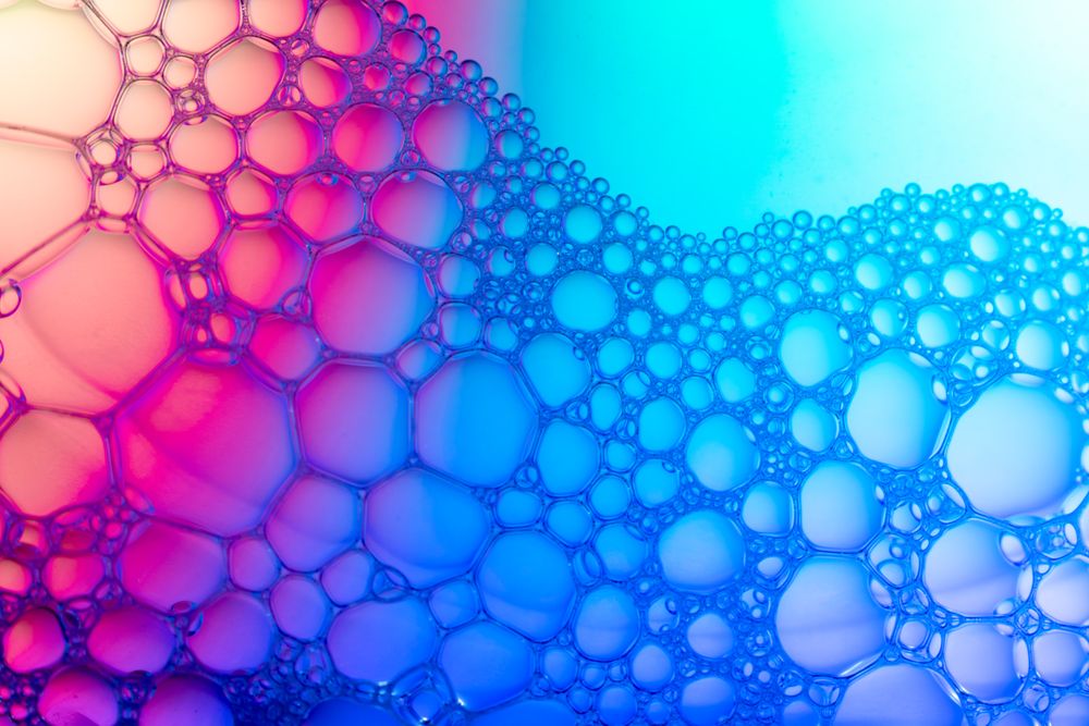Abstract background bio technology, macro photography foam and water with gradient background. Molecule multicolor backgorund