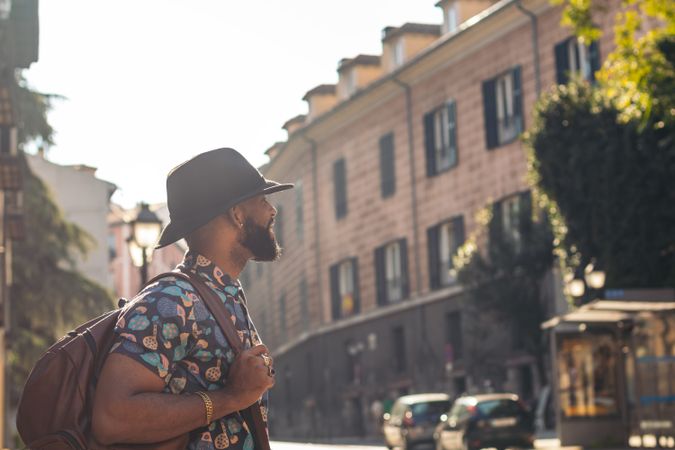 Stylish Black man walking on the city street