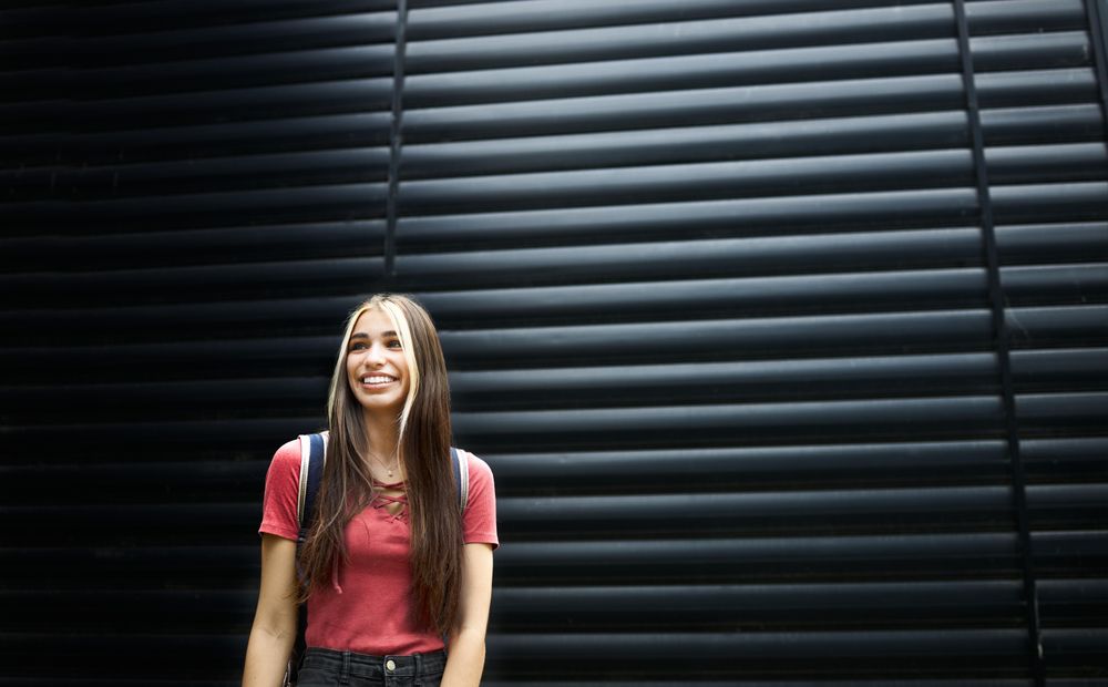 Smiling young woman in t-shirt
