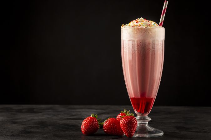 Strawberry milkshake with whipped cream.