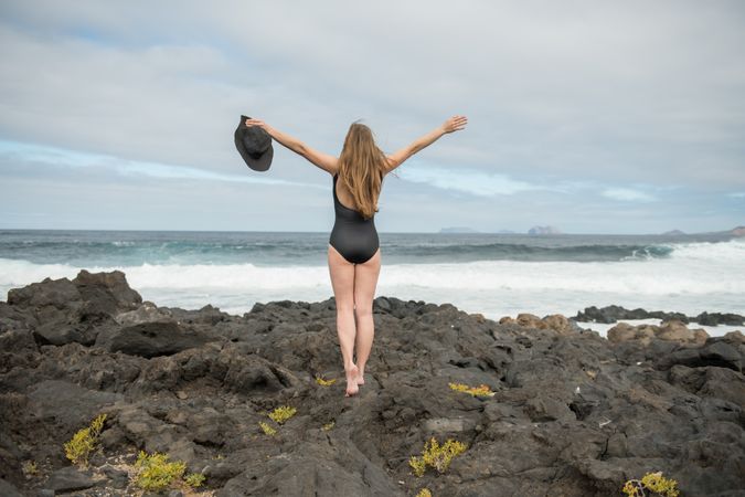 Sensual female near stormy sea