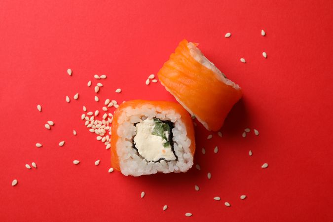 Delicious sushi rolls on red background. Japanese food