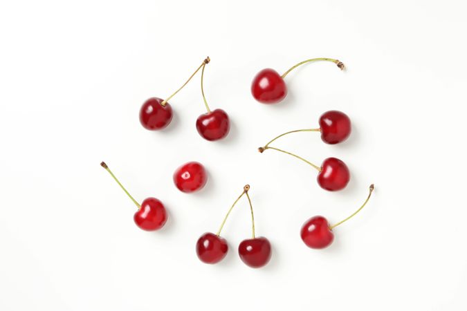 Ripe juicy cherry fruits on a light background