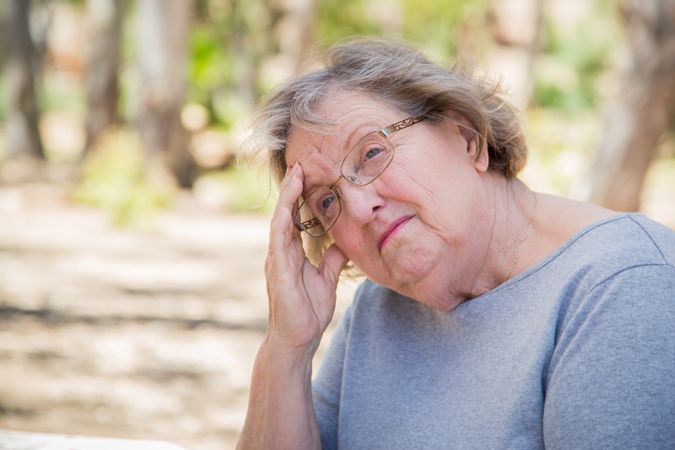 Upset Mature Woman Sitting Alone