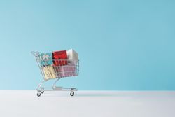 Shopping cart full with gift boxes