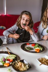 Girl eating vegan food at home