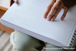 Cropped image of person reading using braille system 489qqb