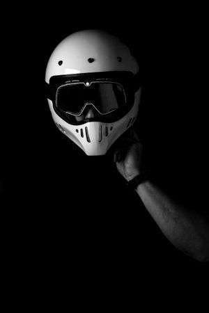 Rider in helmet and glasses at studio