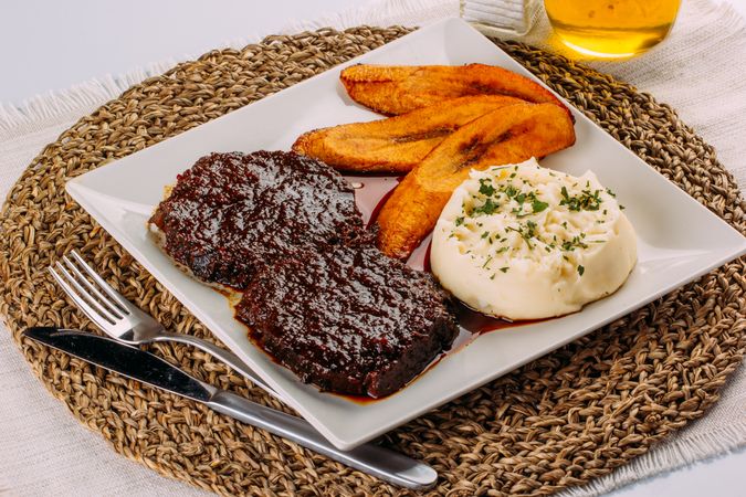 Homemade Venezuelan food, Beef, Mashed potatoes and Fried plantains