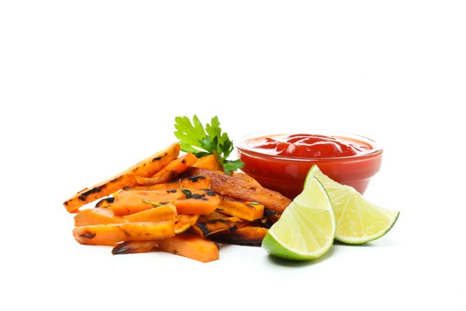 Concept of tasty food - sweet potato fries, isolated on light background