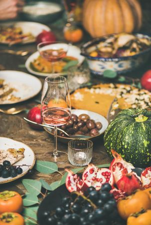 Festive fall dinner with wine, squash, olives, pie