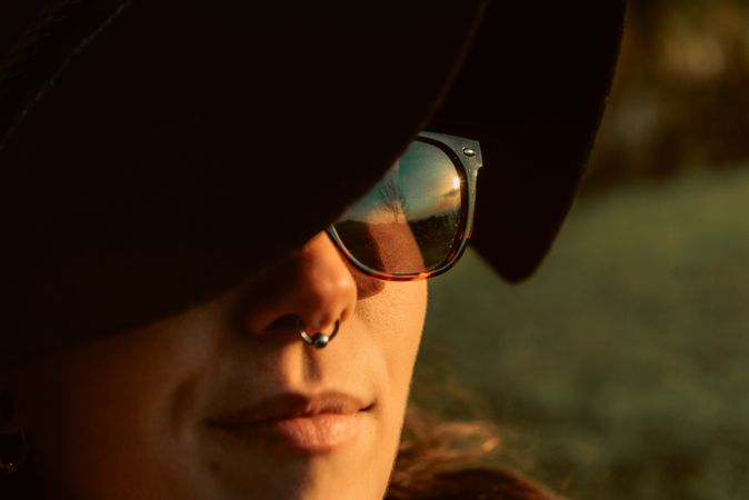Stylish young woman in hat outdoors
