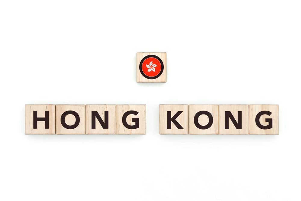 Wooden blocks bearing the name and flag of Hong Kong. HongKonger and Asian Culture, national identity, travel, and geography in a copy space design.