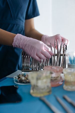 Cropped image of dentist preparing medical tools