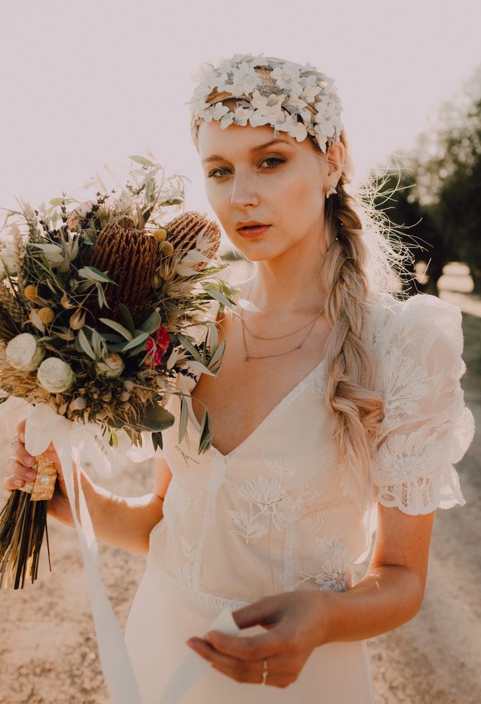 Woman in dress with flower bouquet