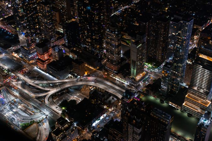 Aerial View of New York City. Helicopter Photo of a Highway in New York City. Panoramic View with Traffic Around a Big City with Skyscrapers in the Background