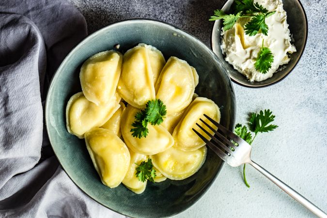 Traditional Ukrainian vareniki in grey bowl