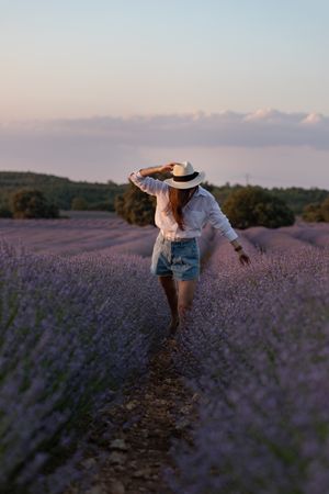 Woman walking in lavender field