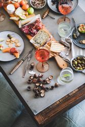 Charcuterie, with wine, cheese, hazelnuts, prosciutto, melon