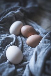 Raw eggs on tablecloth