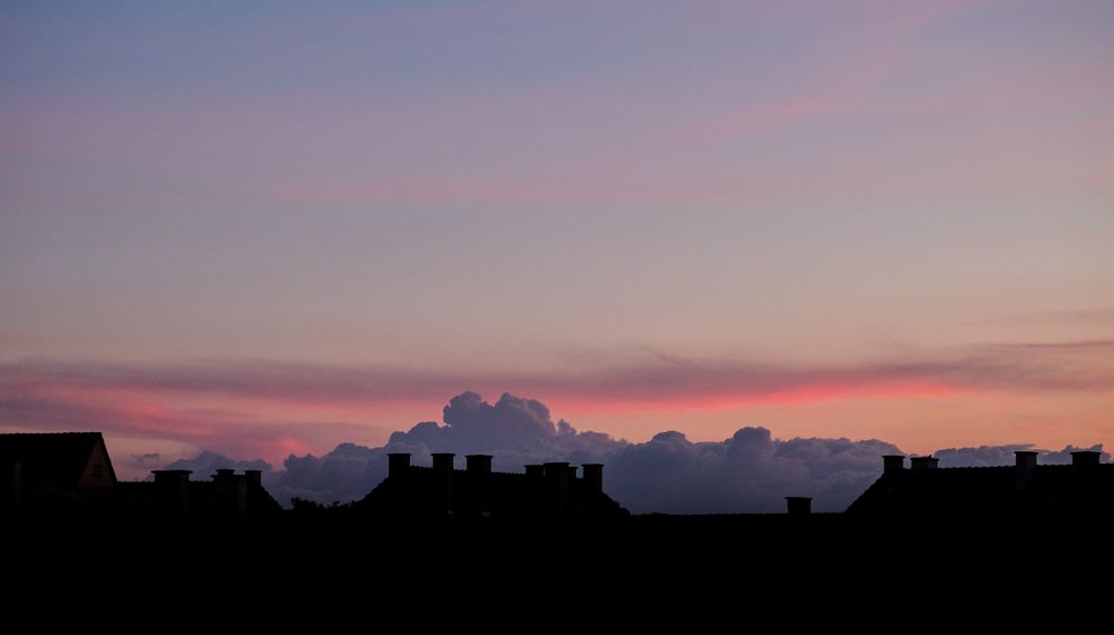 Beautiful purple clouds over a French village