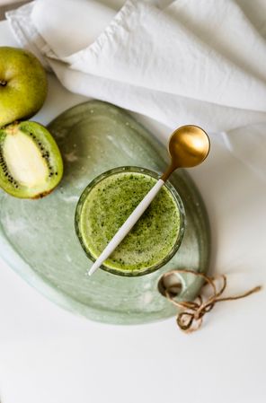 Healthy green smoothie on stone table