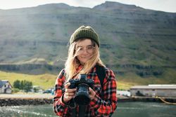 Woman checking photos she took on camera