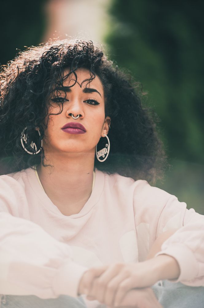 Portrait of modern Black woman with curls