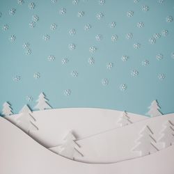 Christmas winter landscape with snowy hills and trees