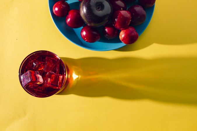 Red drink near fresh fruits