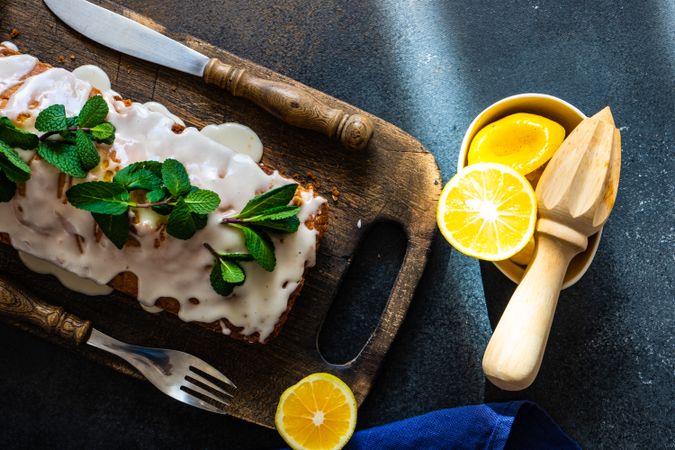 Tasty homemade lemon cake with fresh mint garnish and fresh lemon slices