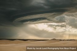 View of dramatic sky and sand dunes in desert 0PXJO0