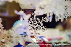 Glass snow flake decoration for sale in Christmas market in Strasbourg, France 0yRoq5