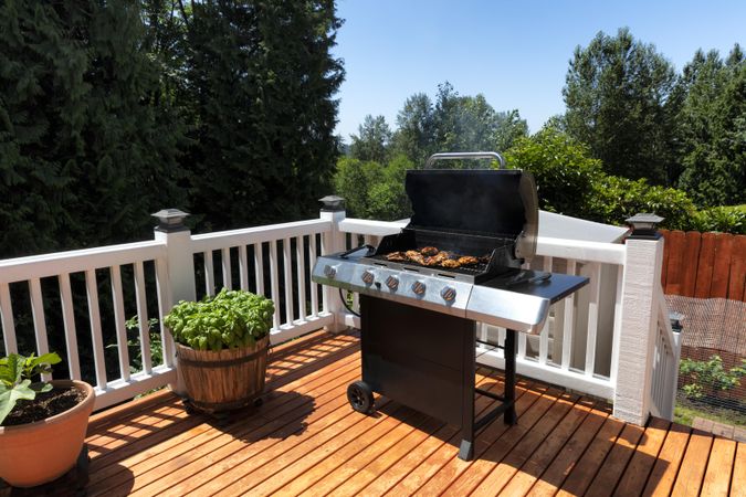 BBQ cooker on home outdoor deck in close up view