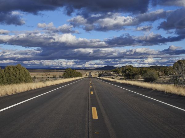 Desert highway stretching to the horizon in Arizona