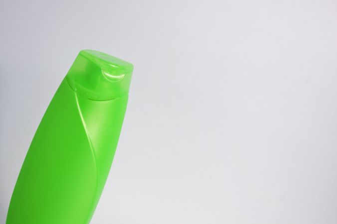 Green mockup shampoo or body wash bottle