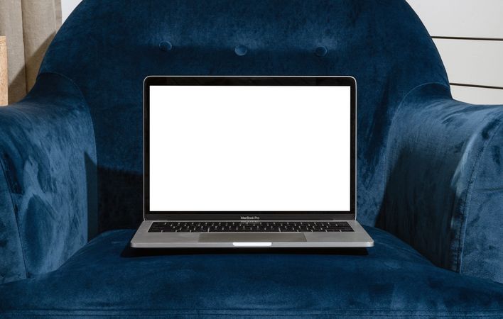 Couch with laptop with blank screen for mockup