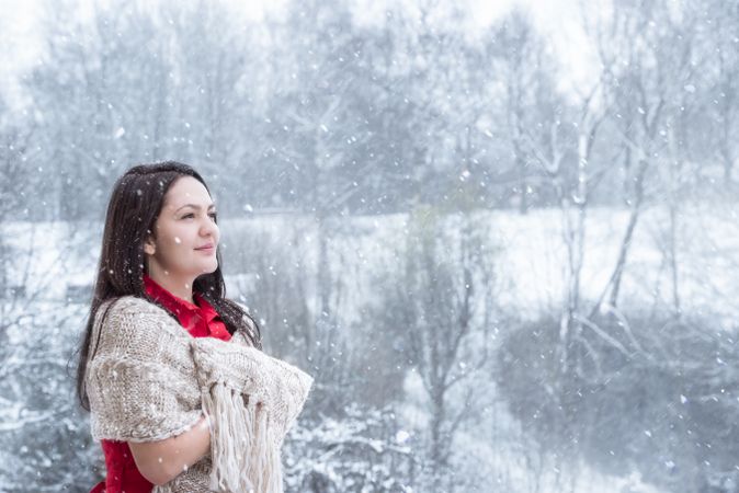 Brunette woman under snowfall