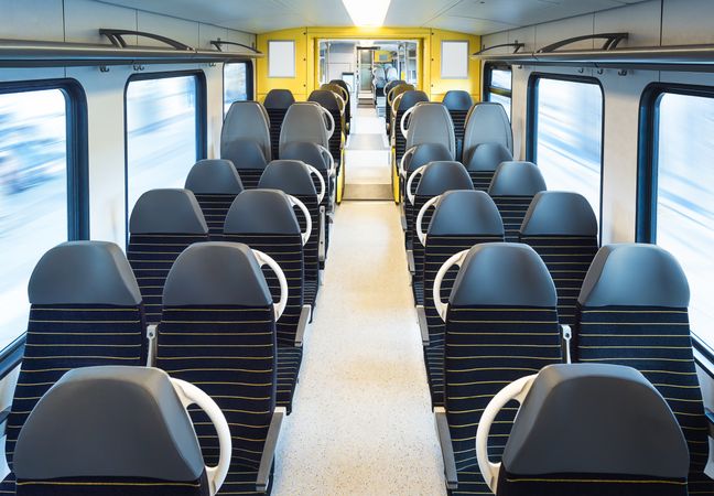 Train interior with empty chairs