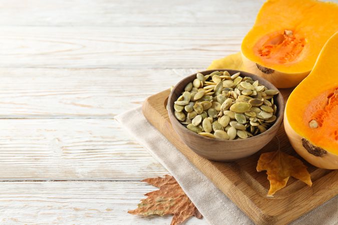 Concept of Autumn vibe food, Pumpkin, Pumpkin seeds, space for text