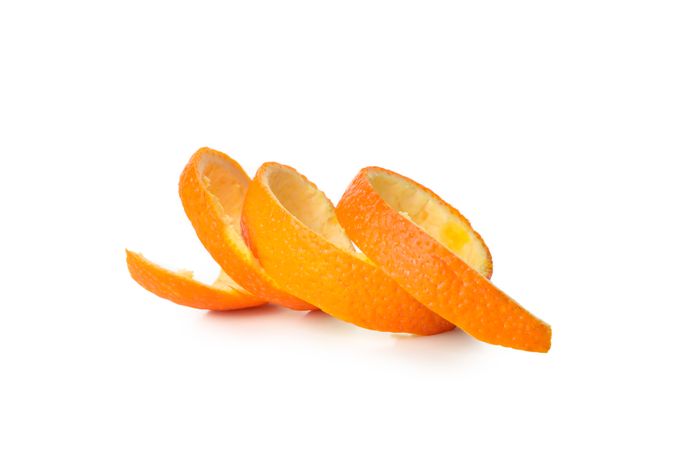 Spiral of mandarin peel isolated on light background