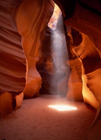 Sunlight beaming into Antelope Canyon curvy slot canyon