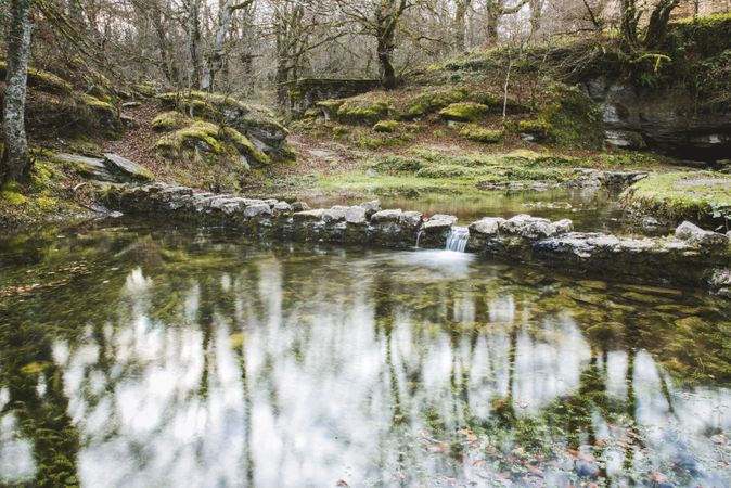 Stones between water in park