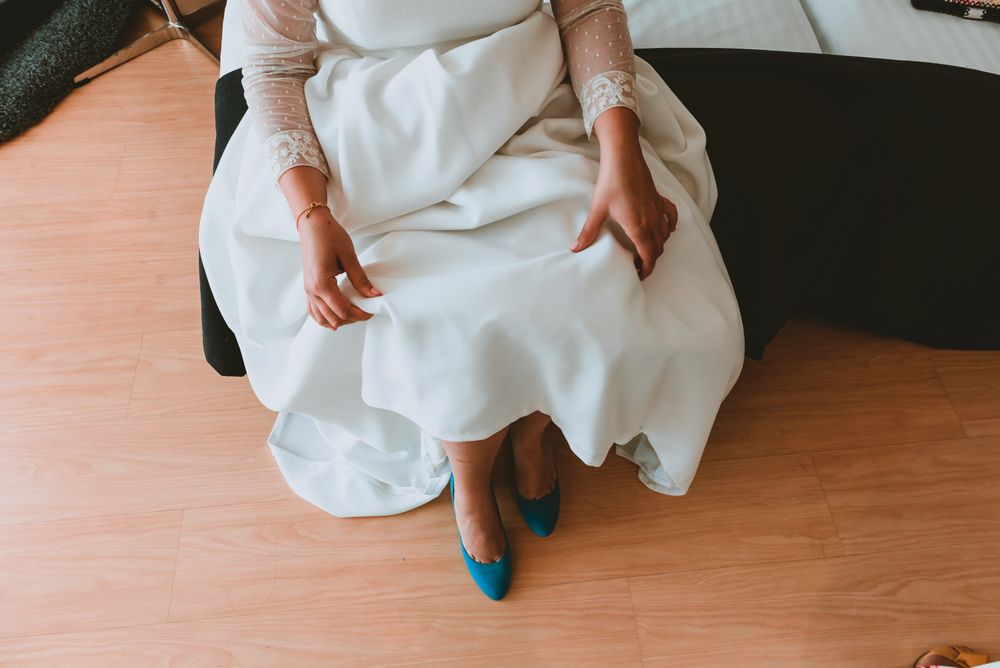 Woman wearing shoe on lady foot