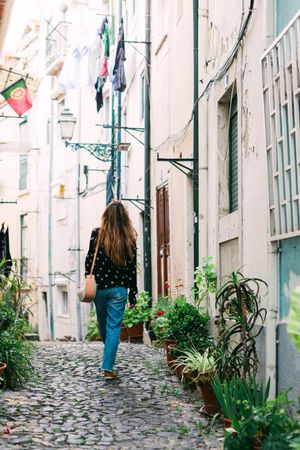 Woman strolling on old city street