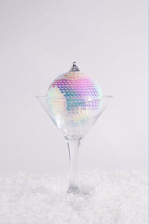 New Year disco bauble ornament captured in a martini glass