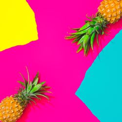Pineapples on pattern of ripped paper in vivid colors